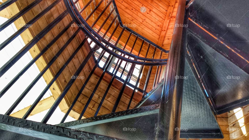 Architecture. Looking Up a Spiral Staircase in an Outdoor Pavilion 