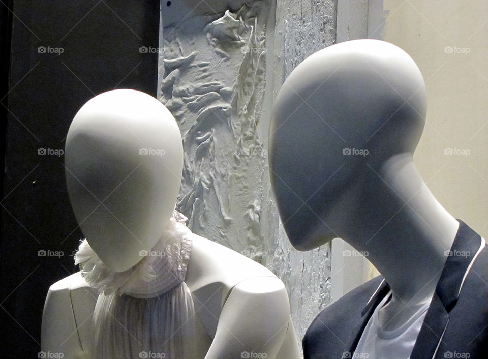 Close-up of two mannequins in a shop window