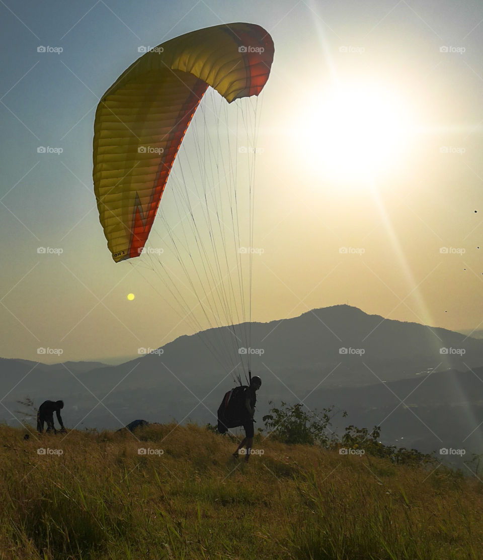 Paraglider Taking off from a hill