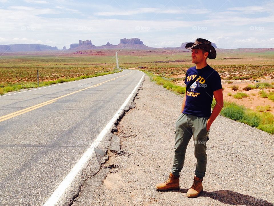 Portrait of man standing on road