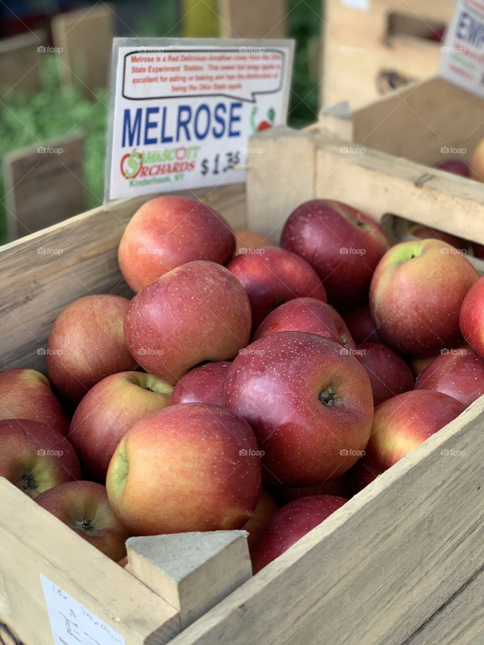 Melrose apples in a wooded create at the farmers market 