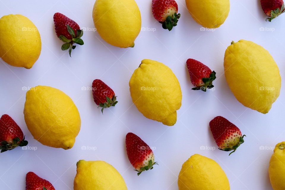 strawberry and lemon on a white background