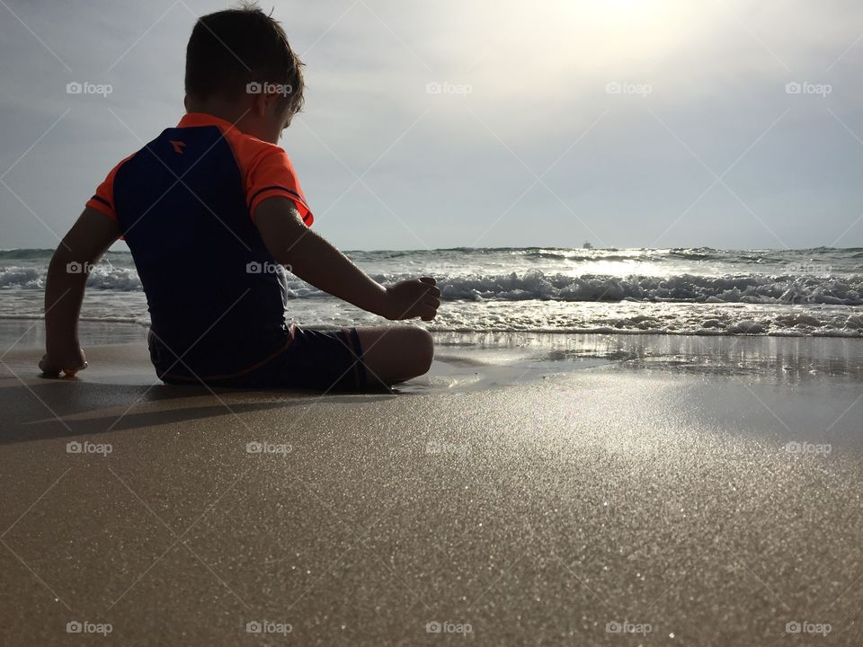 Low angle. Kids enjoying the beach