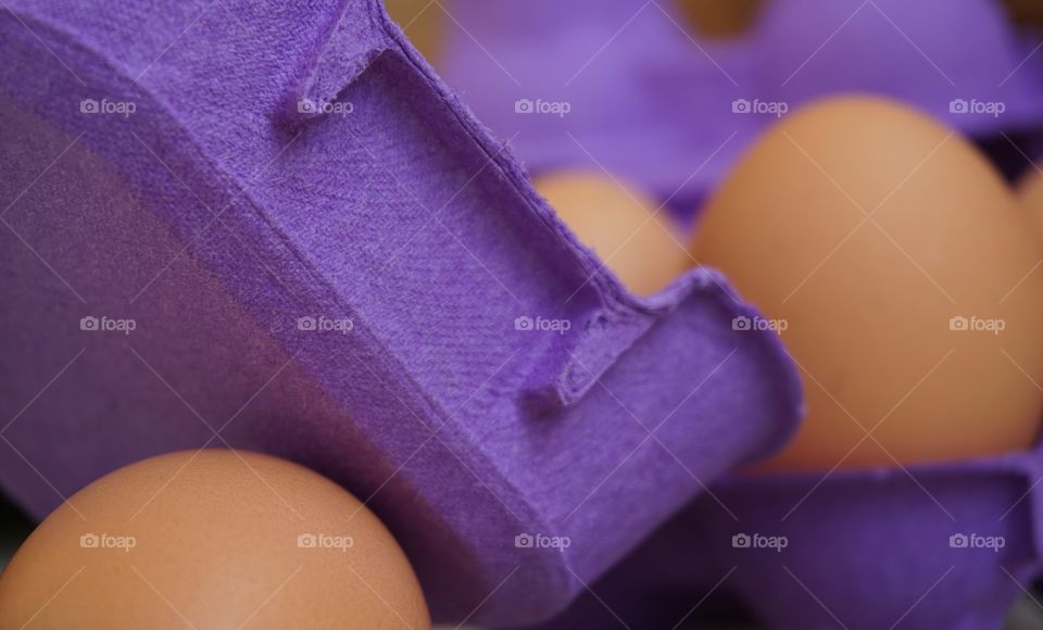 Macro shot of egg carton and eggs