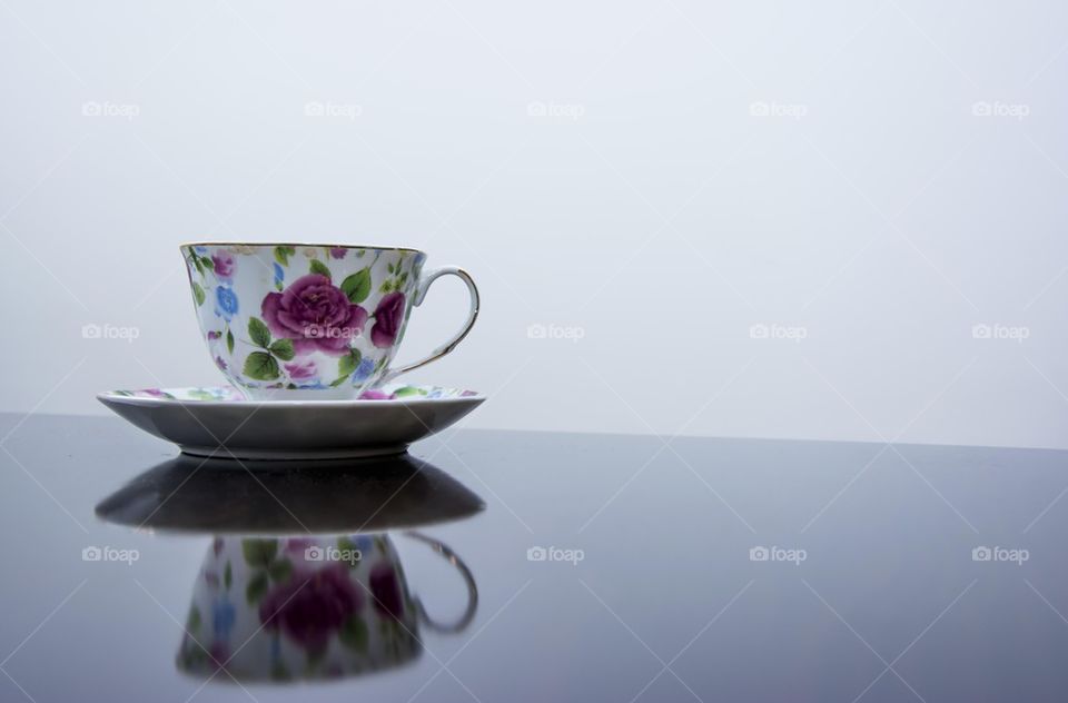 Floral teacup and saucer on table