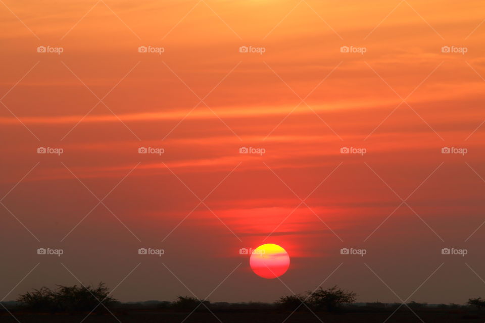 orange hues of sunset sky