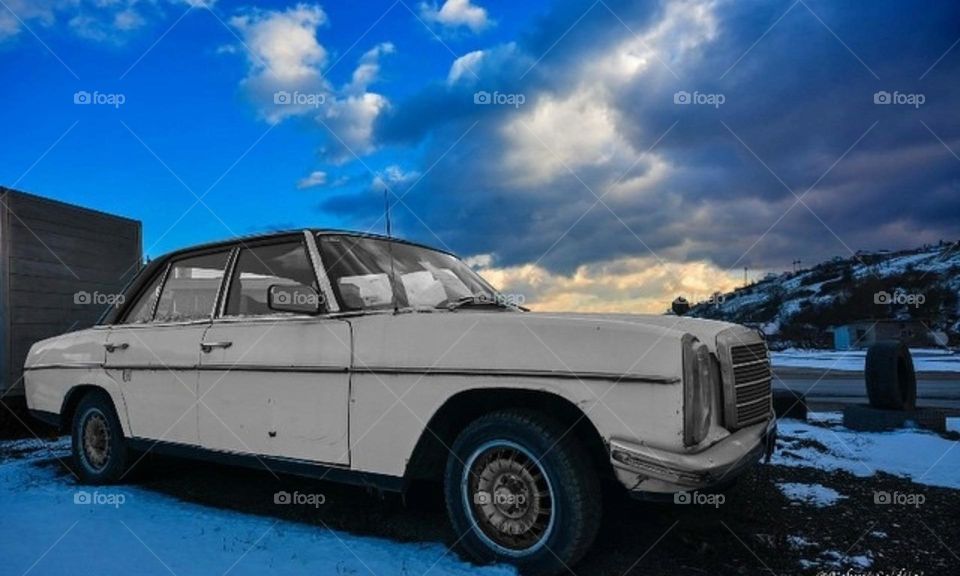 The past whispers in the wind, a silent story etched in faded paint and weathered steel.
