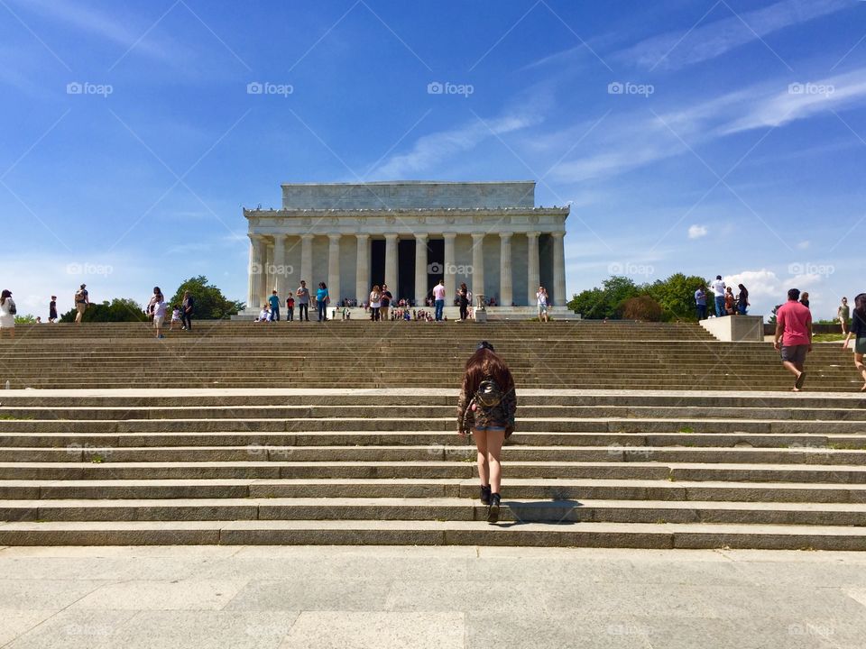A girl going up to Lincoln Memorial building in Washington DC