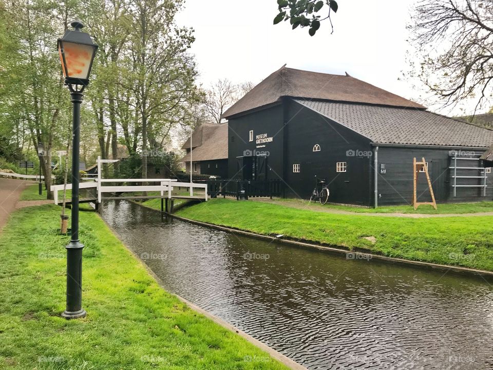 Water canal and houses in Giethoorn, Netherlands 