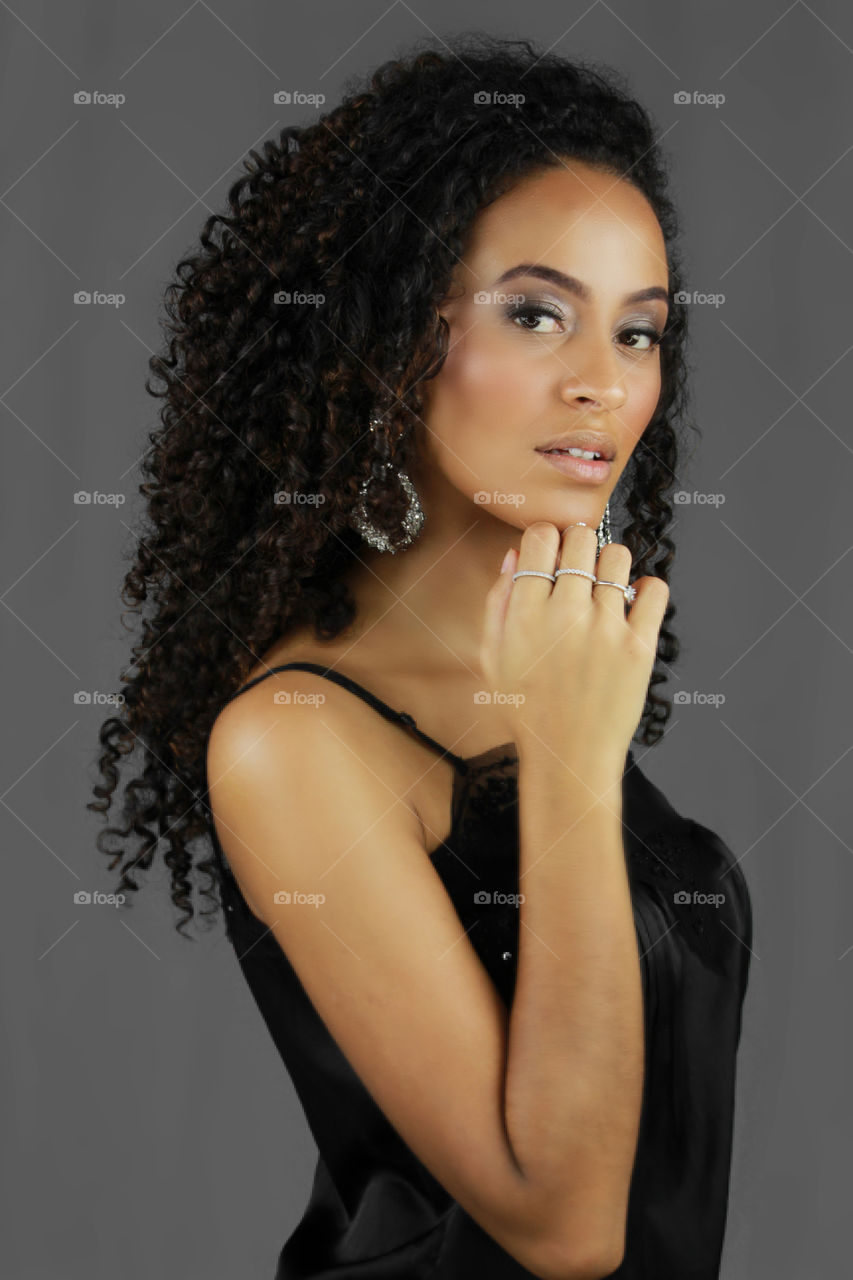 African woman against gray background