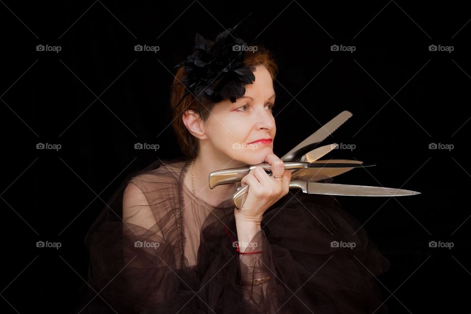 Portrait of woman holding knife