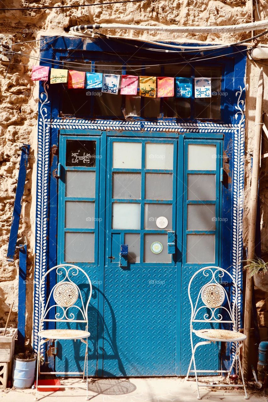Blue door and Colourful flags 