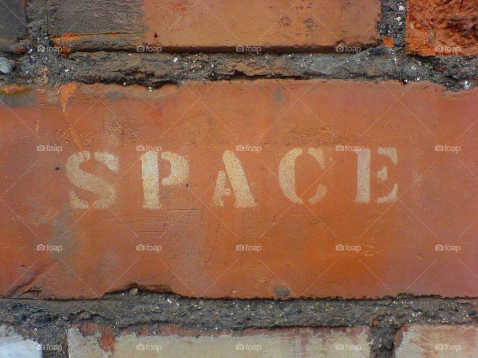 space stenciled on a brick in Bristol opposite Ardman animation