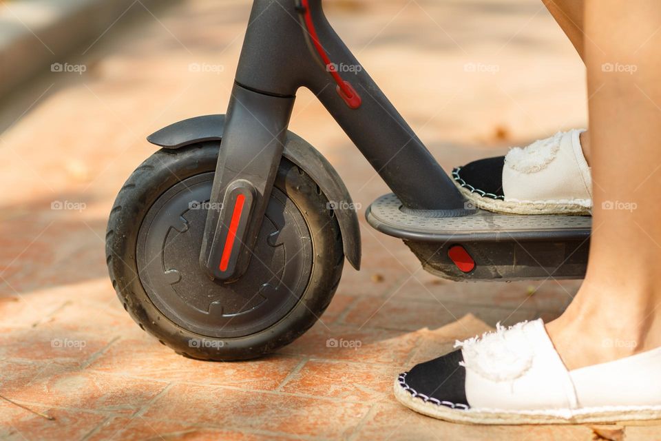 Woman riding on scooter 