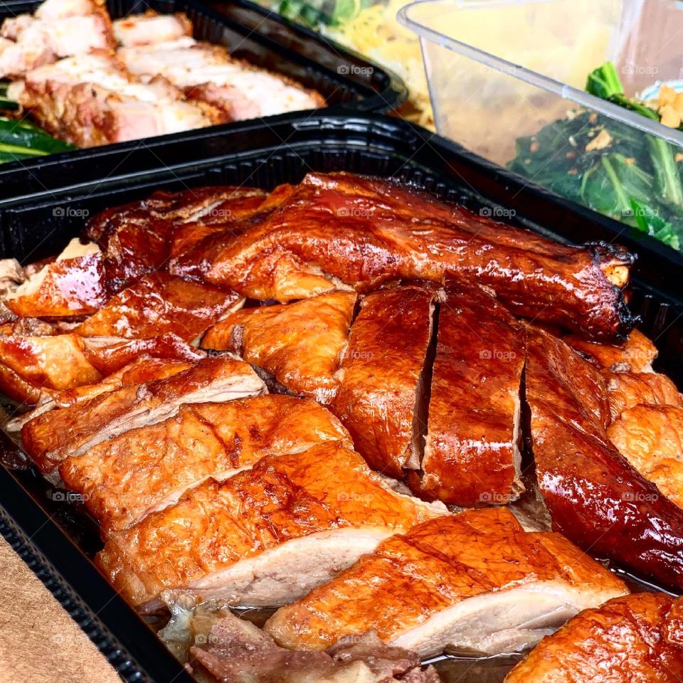 Dang gui duck, roasted pork belly, char siew, century egg dumpling and vegetables 