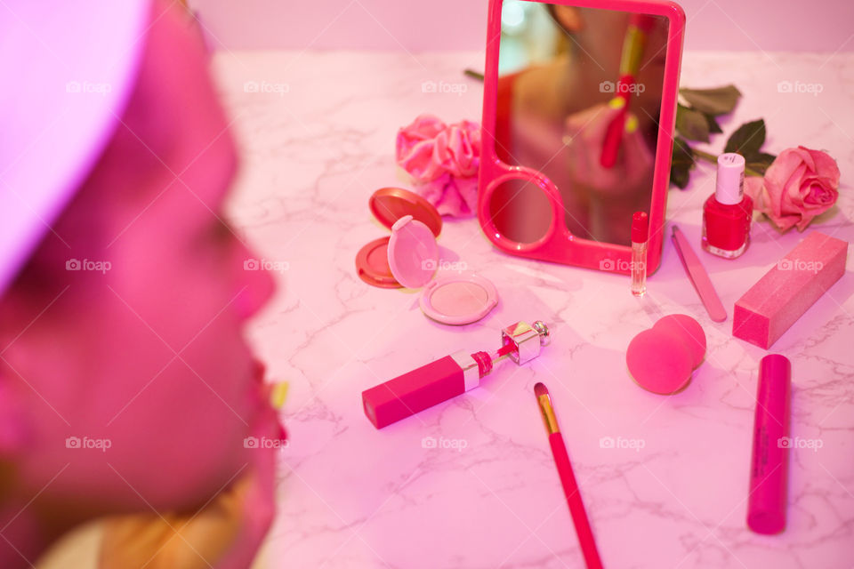 Paint Me Pink; Woman apply blush in a pink mirror and other pink toiletries, captured with Pink Gel Flash