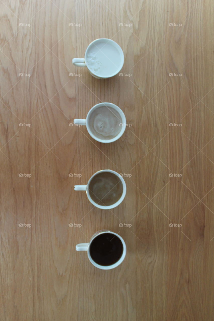 High angle view of teacup's in a row