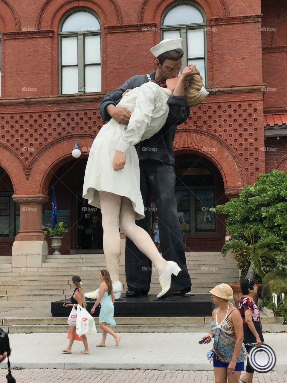 A statue of the famous photo of the sailor kissing the nurse which became a symbol of the end of World War II.  This statue is in the Key West Florida Historic Seaport. 