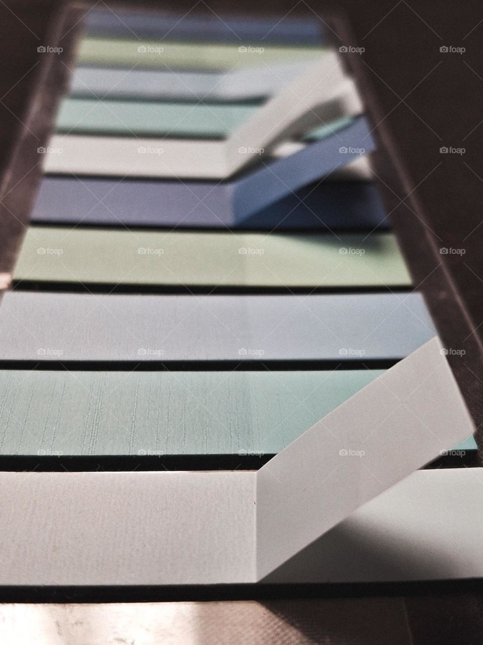 macro photo of fabric stickers in various shades of blue in pastel colors