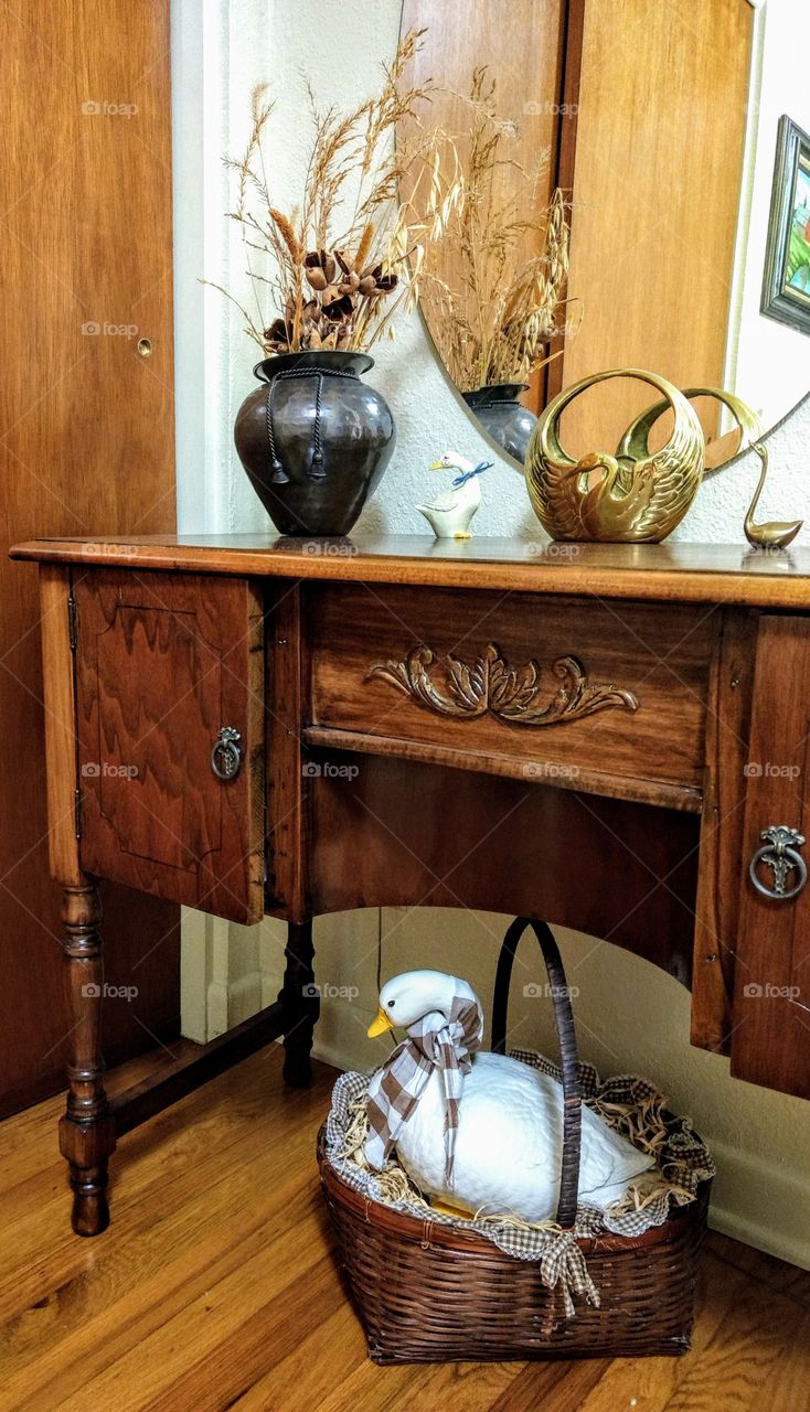 table vanity dresser, farmhouse style interior decorating home decor, ceramics, goose, geese, vase, quaint, rustic, wood table, floor, brown tones