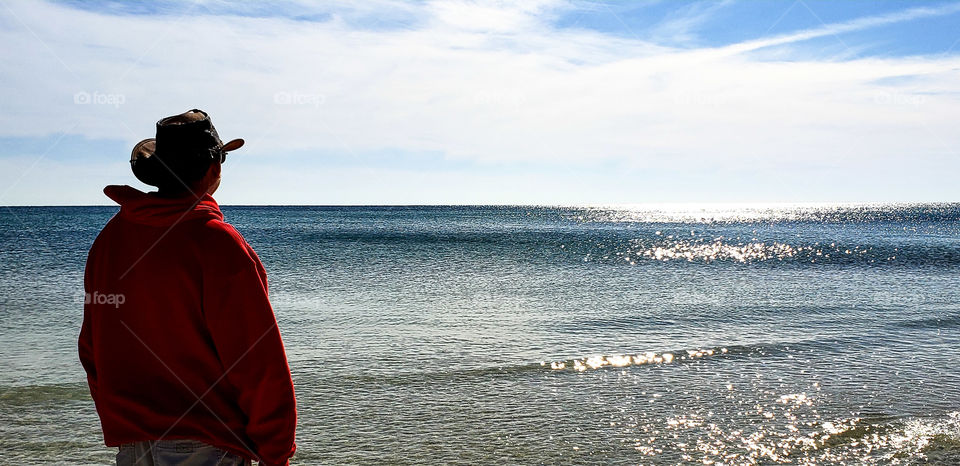 Man watching the tide come in.