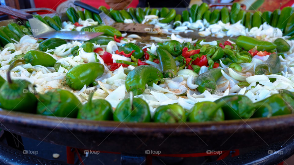 Spicy exotic food, sautéed green chillies