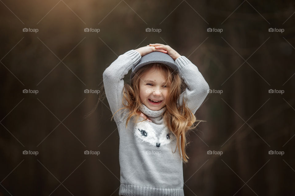 Cute laughing girl outdoor portrait 