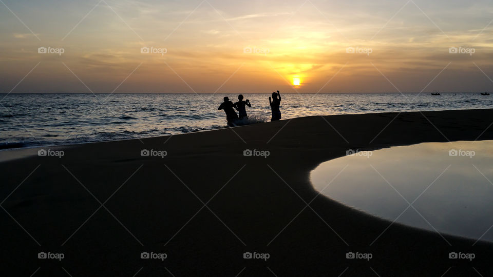 friends playing on the beach
