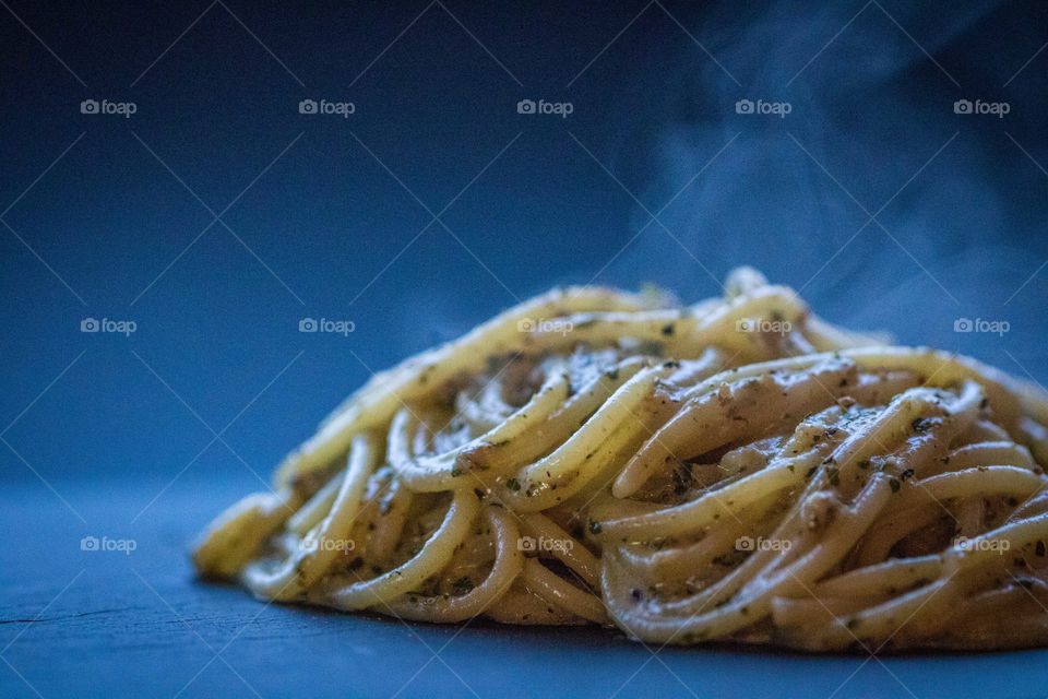 Fresh pasta steaming from the pan