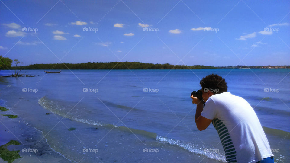 Man taking photos. Man taking photos on the Beach