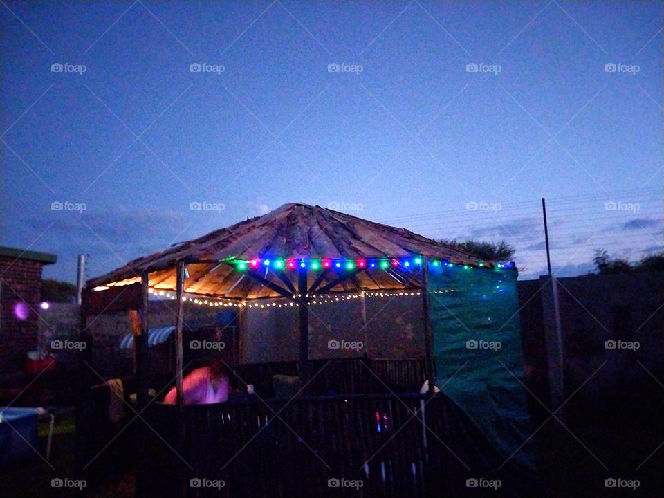 Christmas lights on while ot is getting dark outside