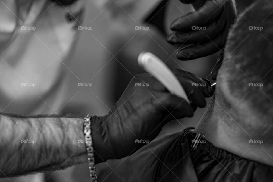 Close-up of a barber cutting hair