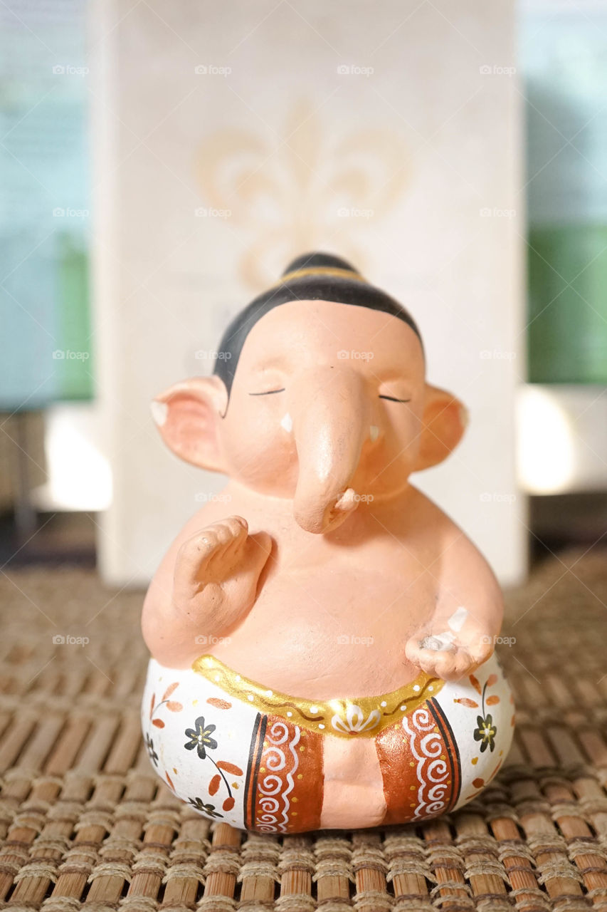 Ganesha, the elephant god of the new beginning. Ganesha is the best known and most worshipped by the Hindus. Also known by many names : Ganapati, Vinayaka & Binayak. Clay work miniature of Ganesha.