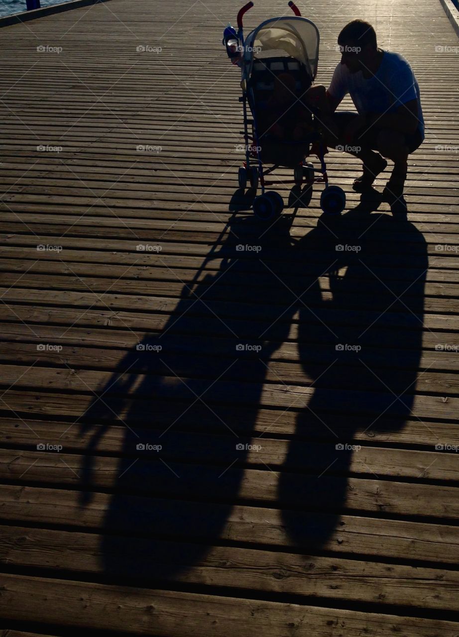 Daddy and baby carriage shadow 