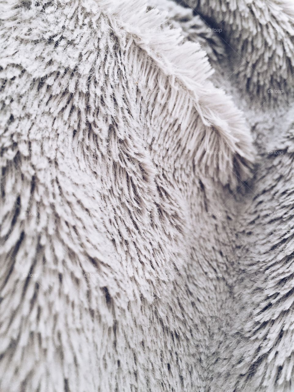 Fuzzy fiber texture closeup grey