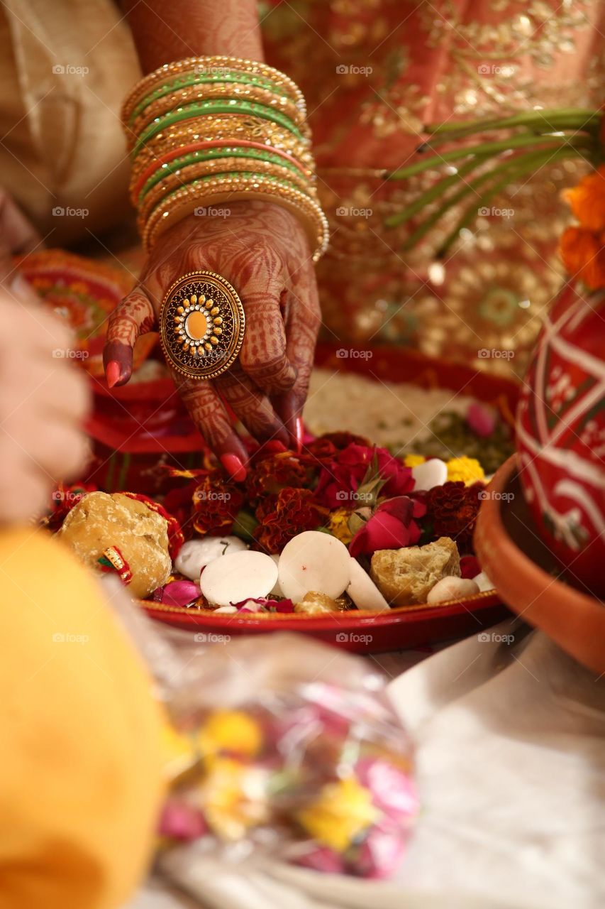 Bride performing Wedding ceremony rituals.
