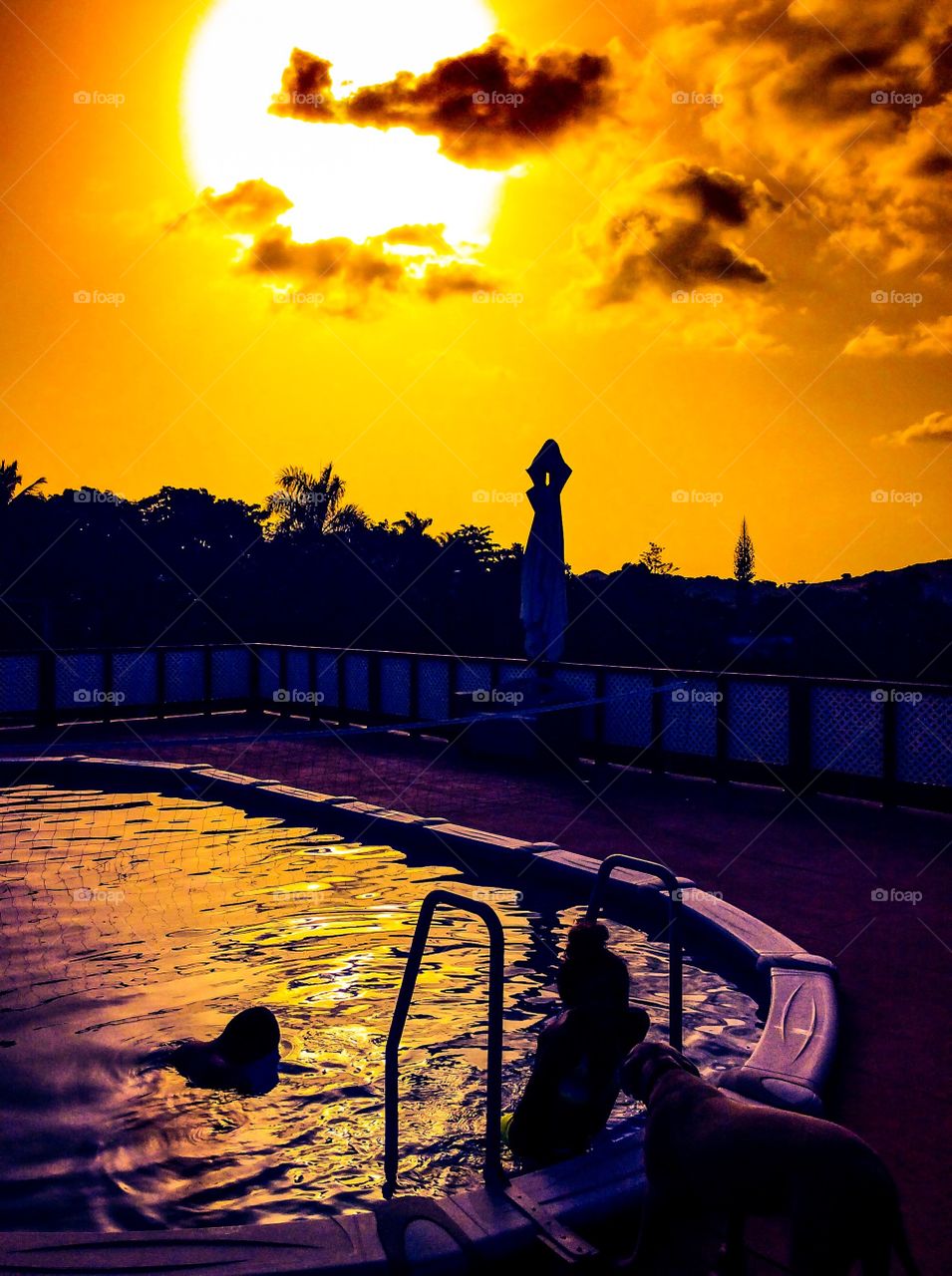 Sun and pool . Kids enjoying the pool