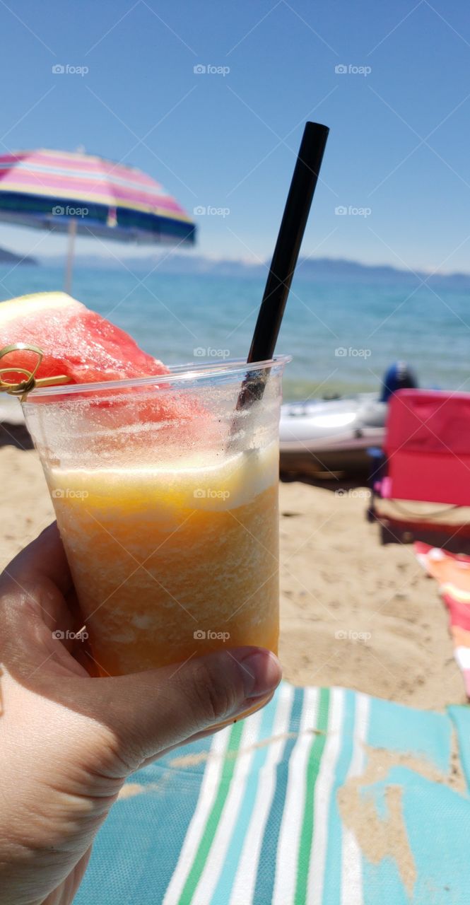 Colorful fruit drink on the beach