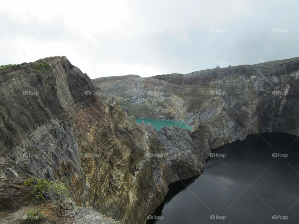 Mountain rocks that form the walls of Lake Kelimutu.