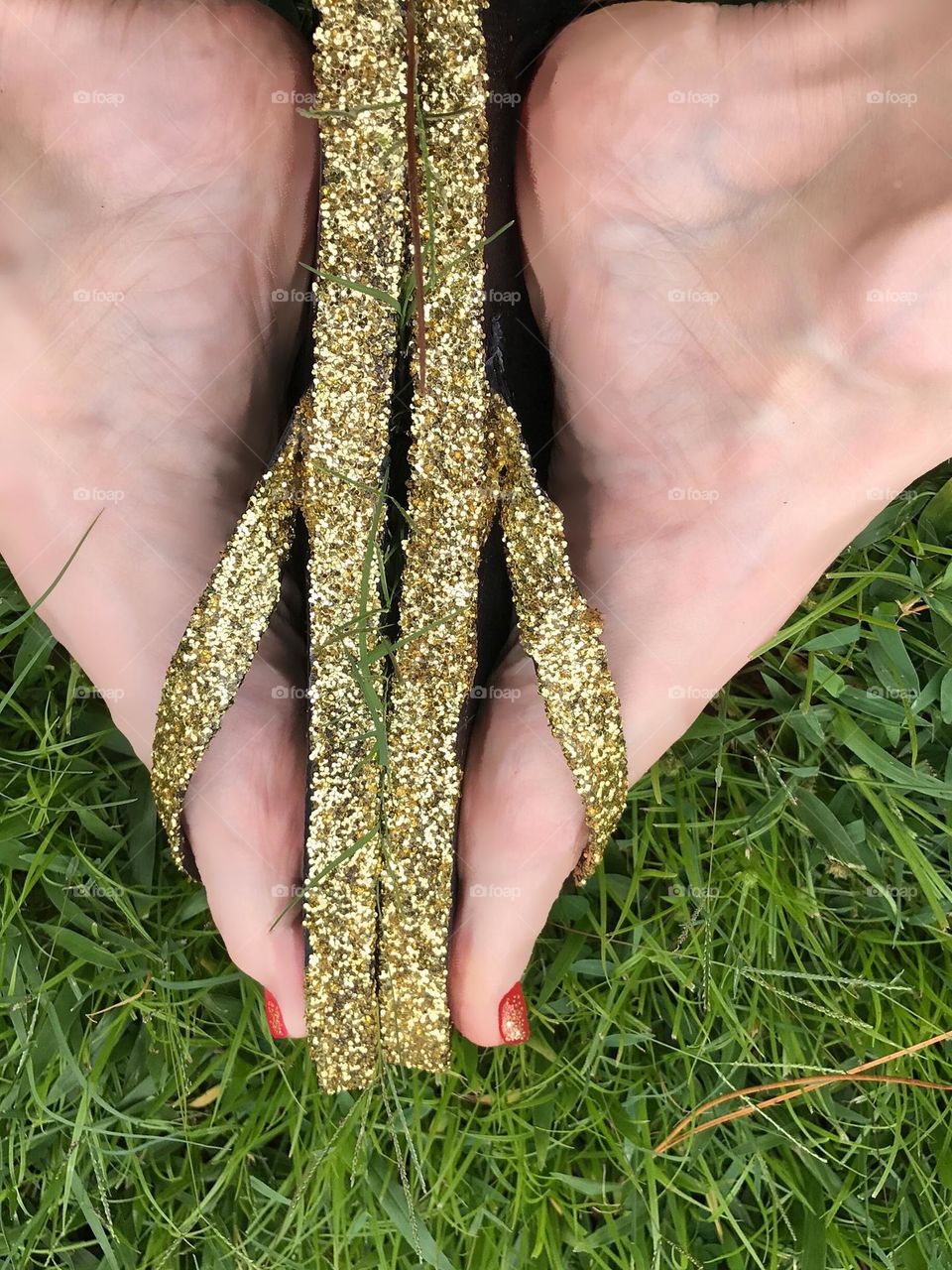 Feet pic- feet in glittering flip flops.