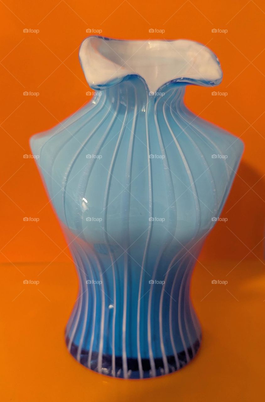Blue vase with orange background