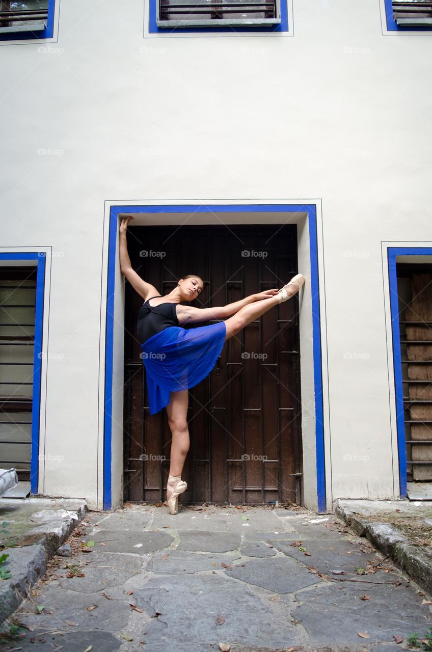 Young Female Ballerina Dancing Outside