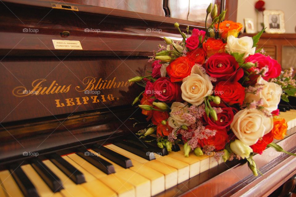 wedding bouquet over piano