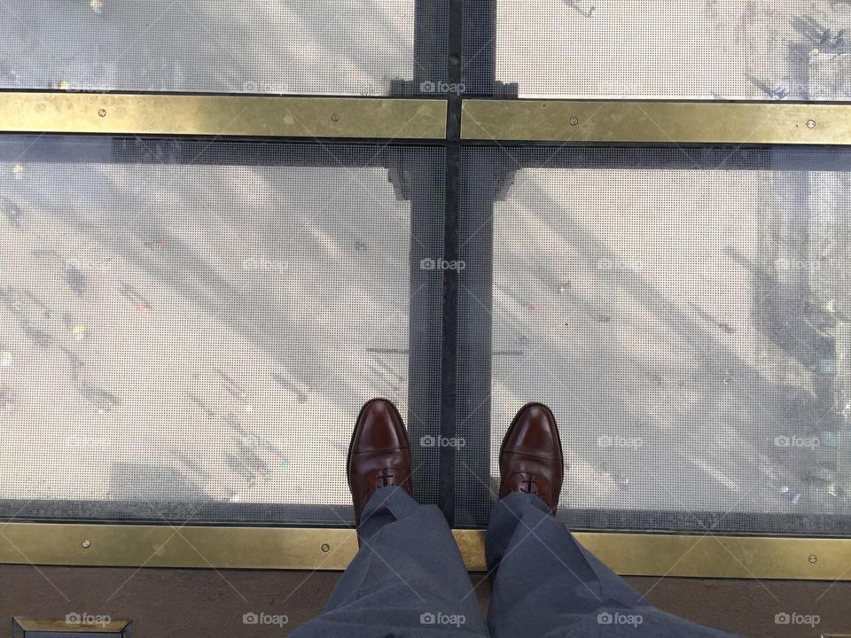 Taken from the first level of the Eiffel Tower through the glass floor.  I hate heights, so I positioned myself with a foot on either side of a girder in case the glass broke. Now that I think about, that probably wasn't a great idea!