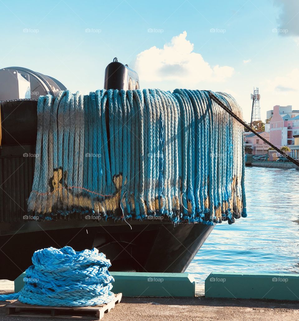 Blue ropes draped over a boat