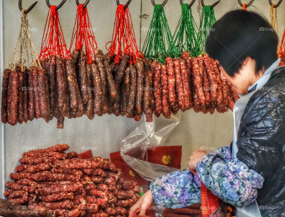 Cured Meats Displayed In Traditional Chinese Butcher Shop. Cured Meats And Sausages In A Chinese Butcher Shop
