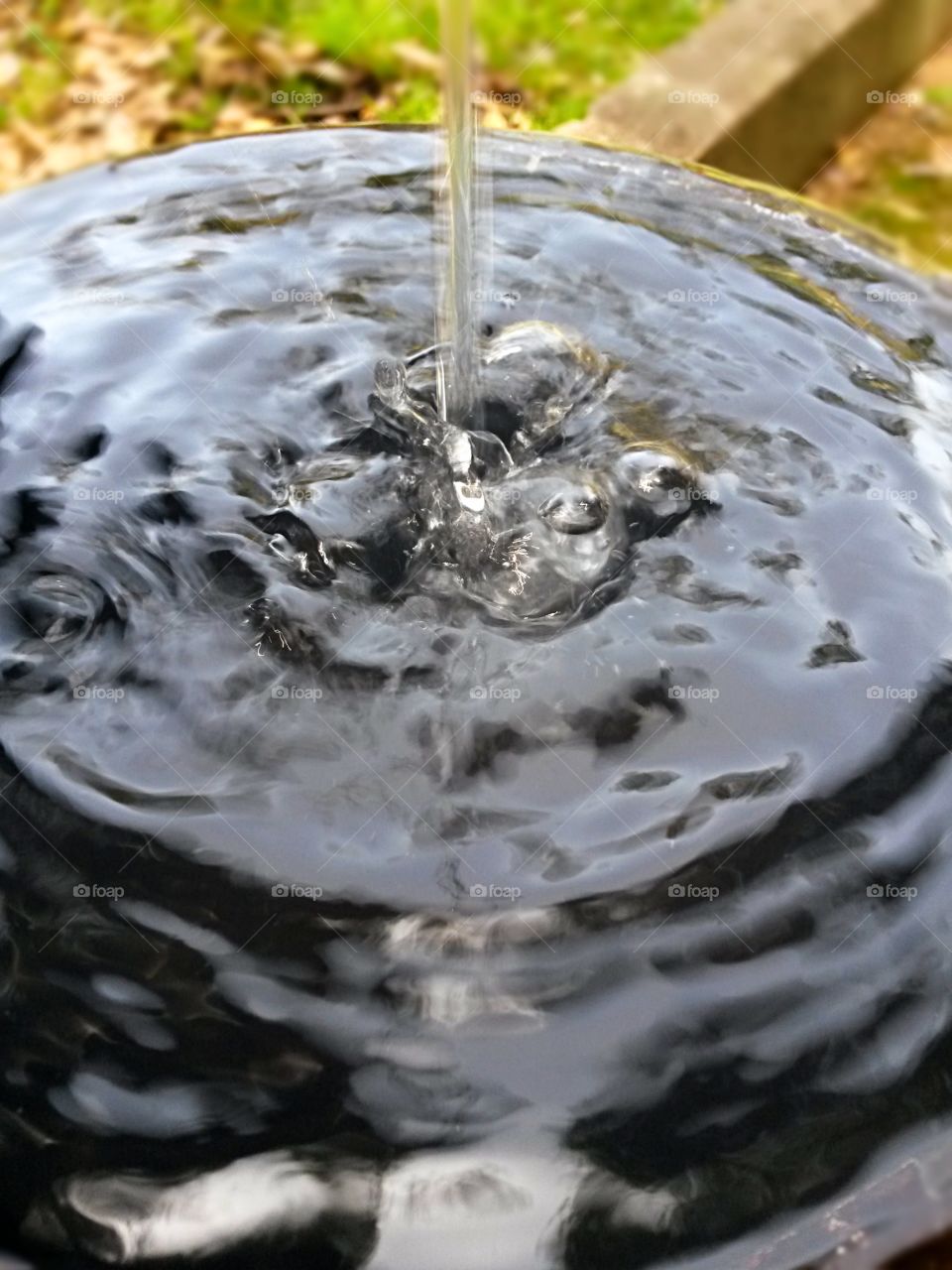 water in motion by a fountain