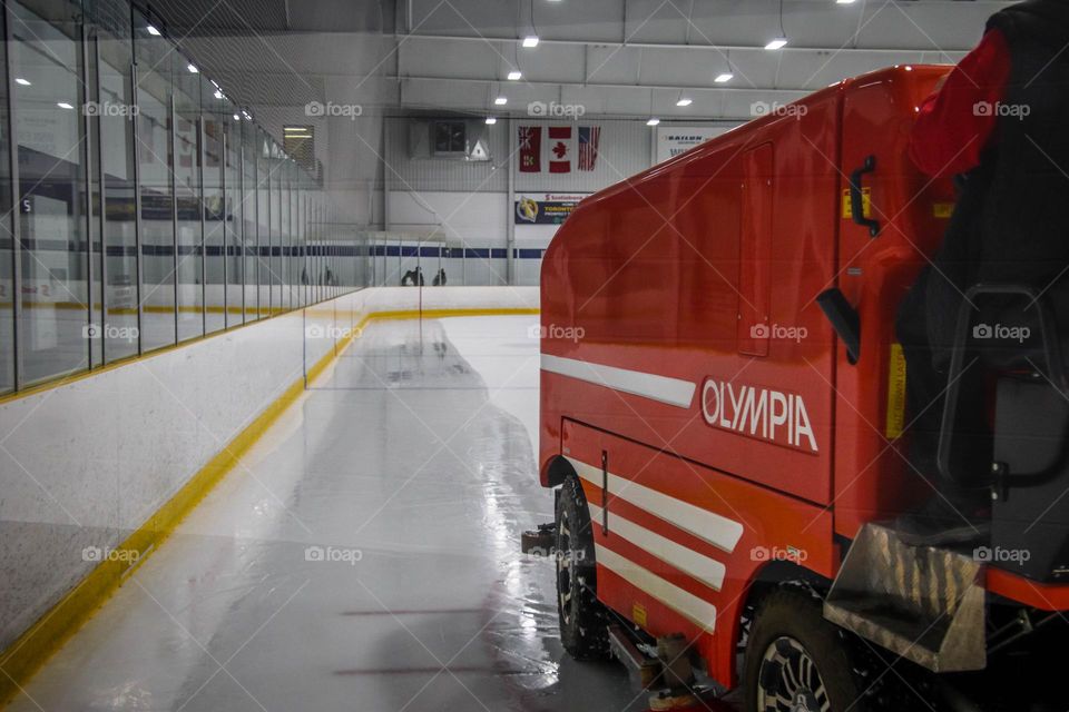 Olimpia machine is cleaning ice on a hockey rink