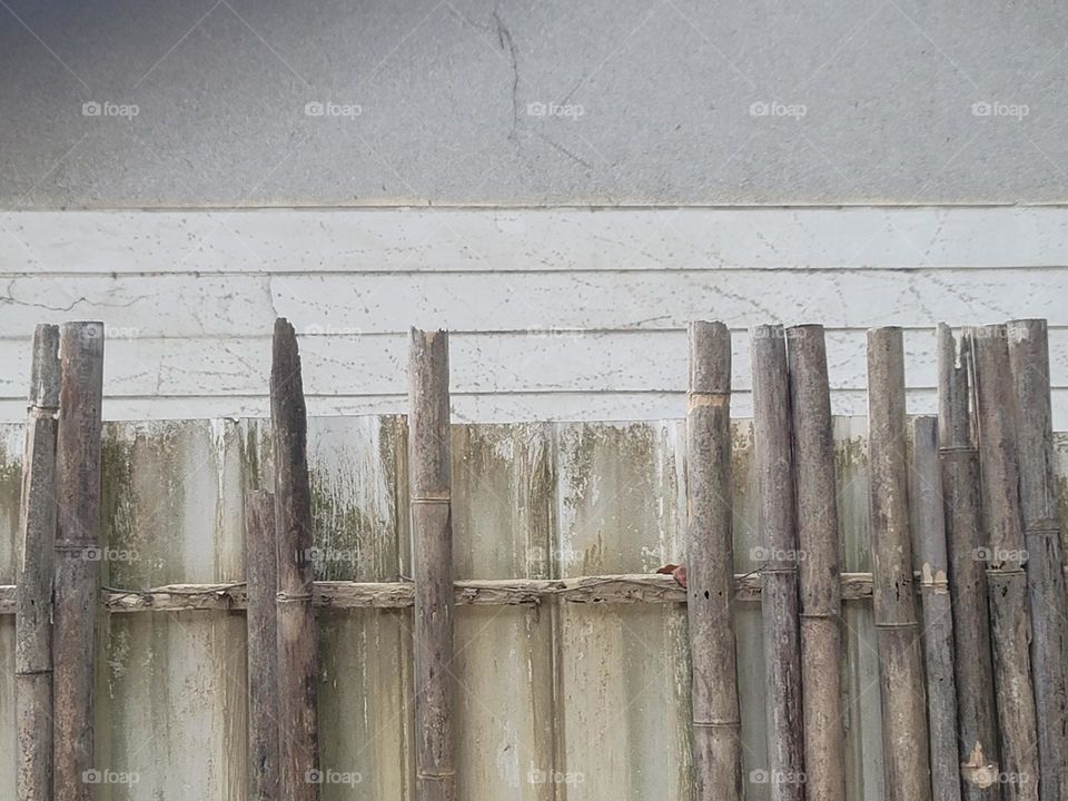 Wall with wooden fence