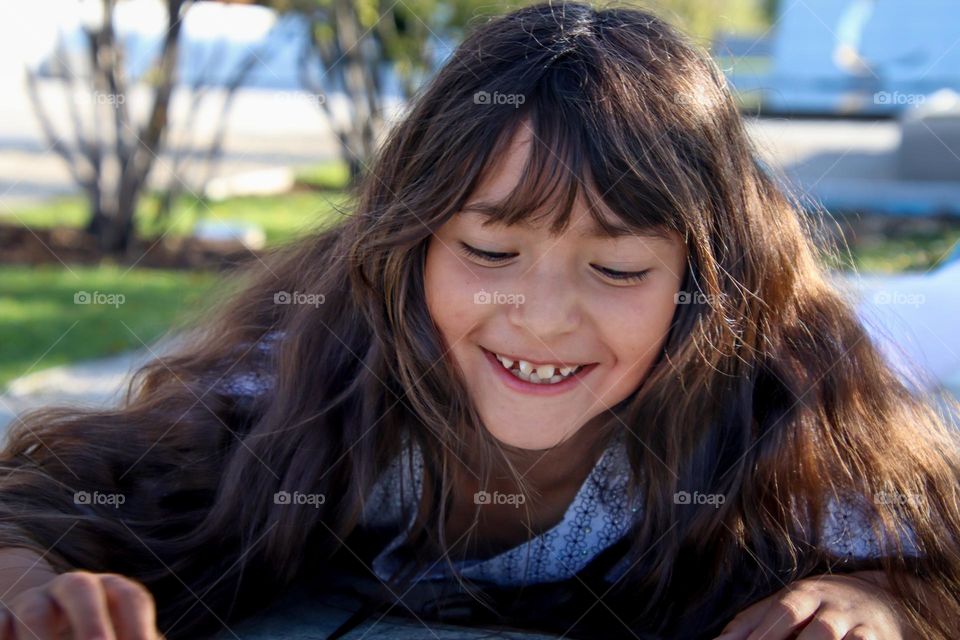 Cute girl with a healthy long hair